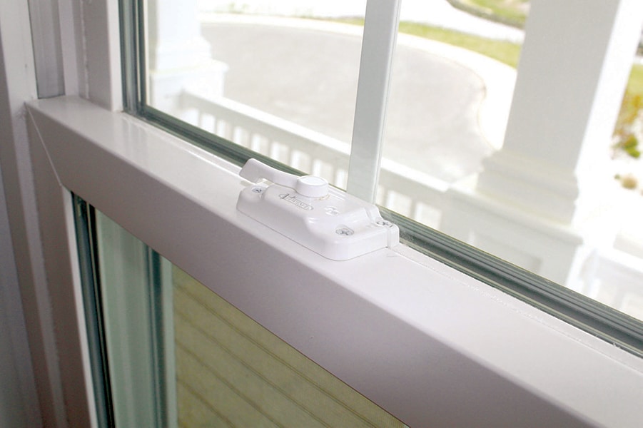 close up of a viwinco tilt-n-lock window latch in an installed window